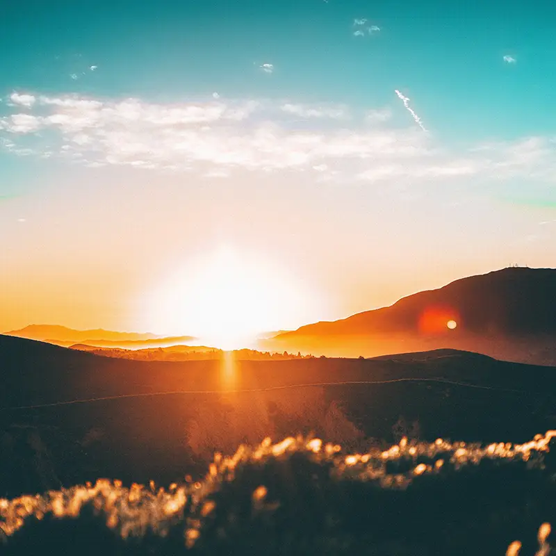 Mountains with a sunset in the background